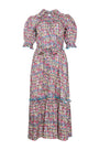 An open V-neckline with a ruffled collar, elbow length puff sleeves with tie details.