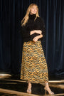 The Suki Skirt is in tiger print this season, with fitted pencil silhouette and easy pull-on design