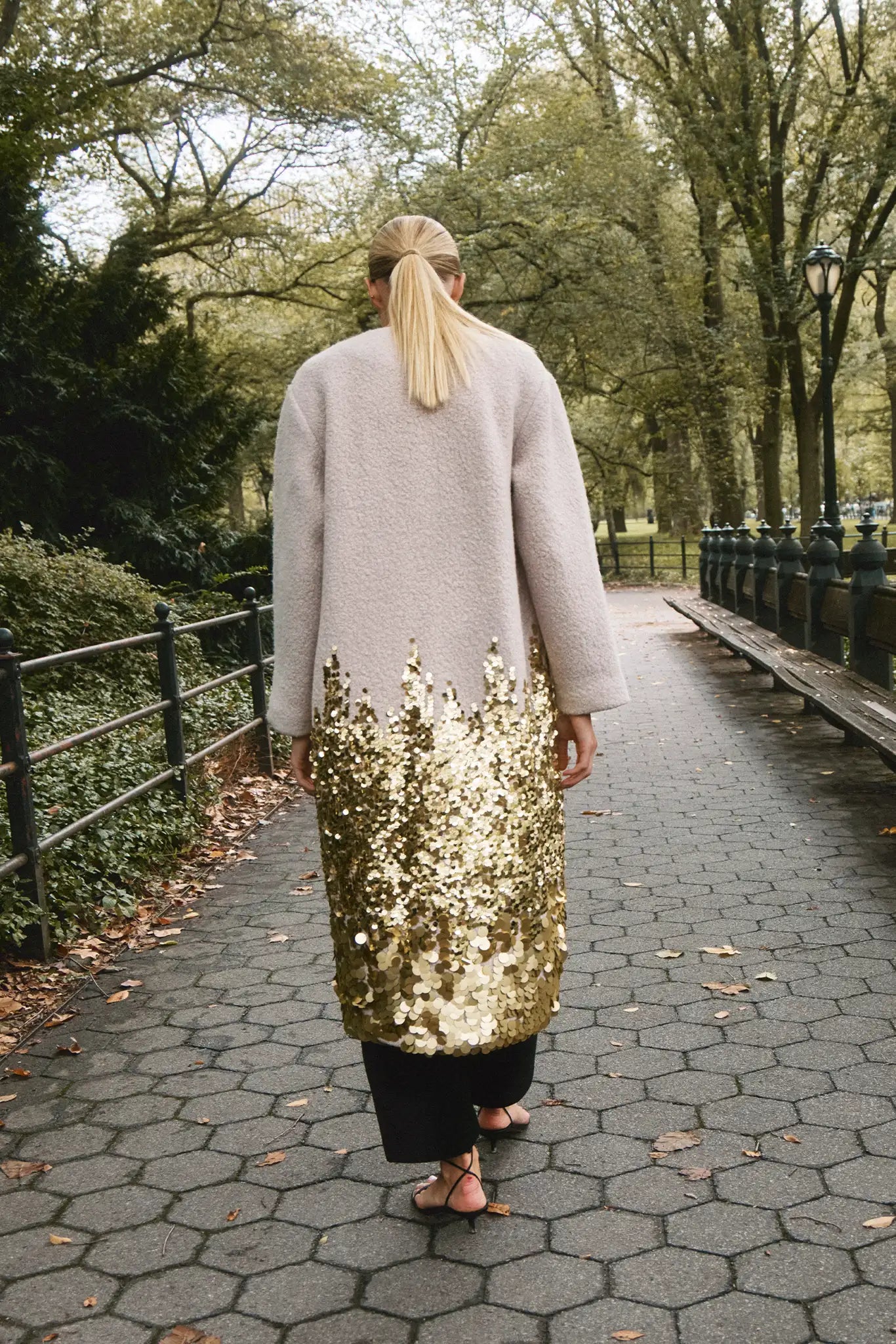 The Tinsley Coat is in our City Lights Gold Sequins Bouclé with a rounded neckline and long sleeves.