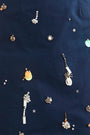 Close up of the Tori Dress in Atelier Splatter Navy. 
