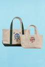 The medium canvas tote bag with green handles and fish motifs with smaller canvas tote bag 