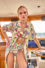 The Bikini Top in Coastal Conversation paired matching with Bikini Bottom & Charlotte Dress on boat