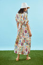 The Charlotte Dress in Coastal Conversation paired with matching two-piece bathing suit