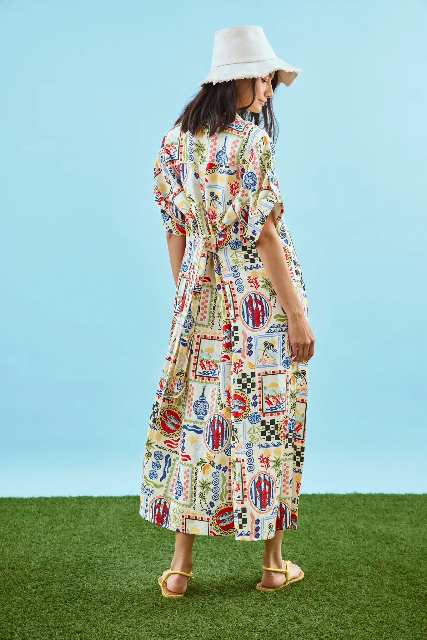 The Charlotte Dress in Coastal Conversation paired with matching two-piece bathing suit