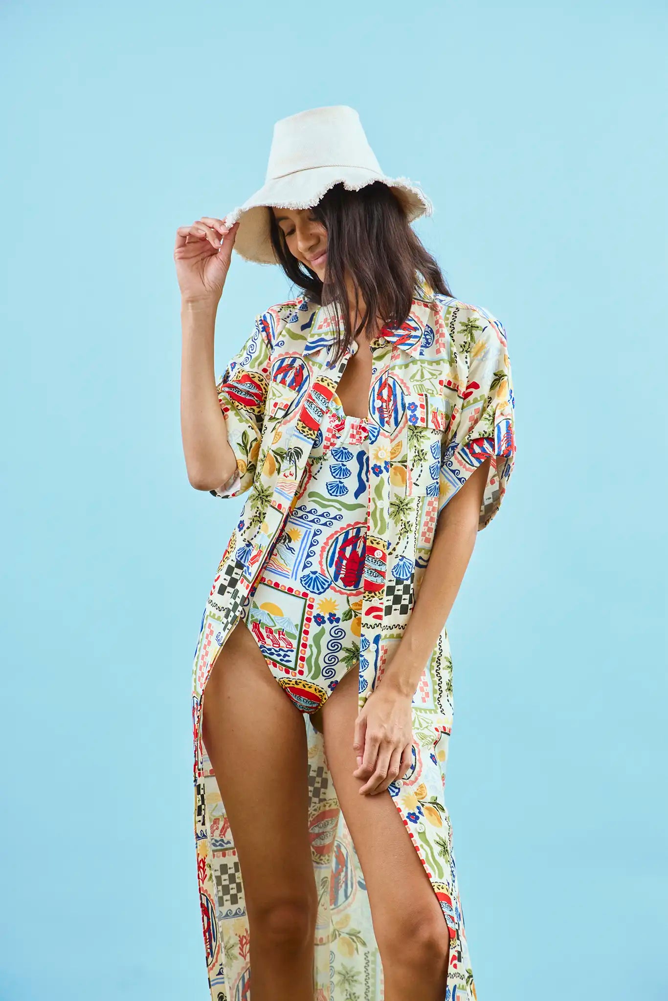 The Charlotte Dress in Coastal Conversation paired with matching two-piece bathing suit