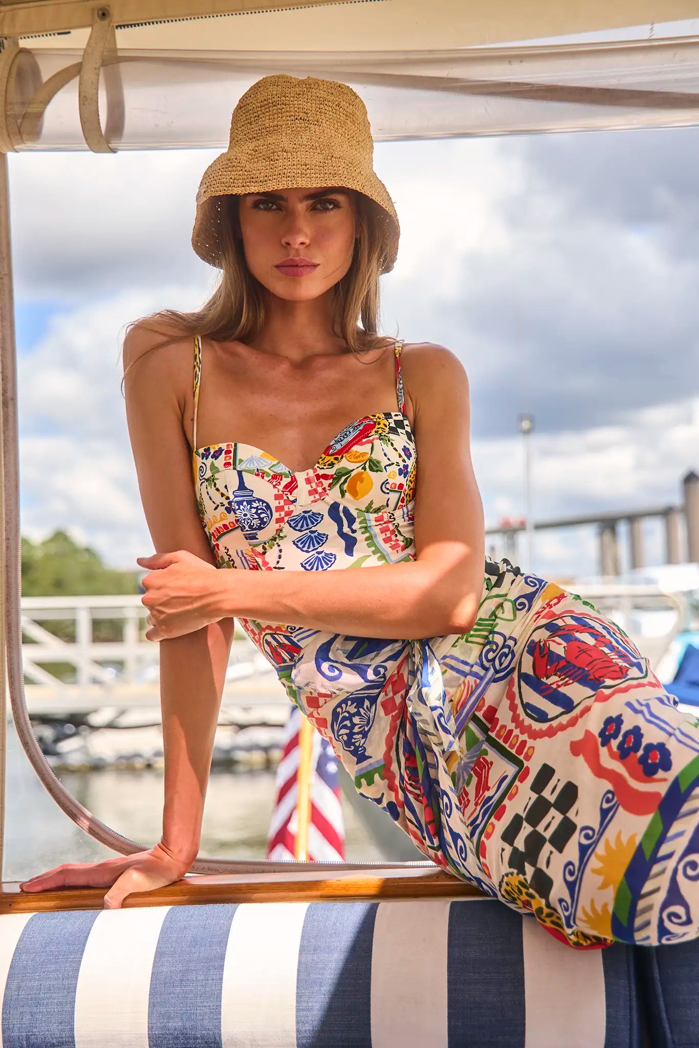 The Underwire One-Piece Swimsuit in Coastal Conversation paired with matching sarong