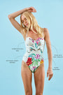 A one-piece white swimsuit with a colorful pattern, underwire bra top, and princess seam details.