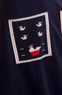 Close up of The Vaughn Dress in Deep Sea. 