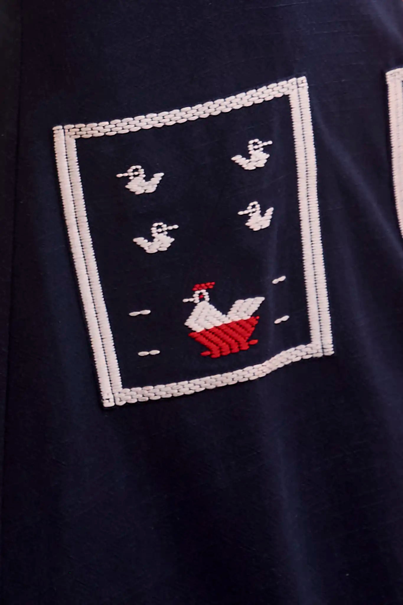 Close up of The Vaughn Dress in Deep Sea. 