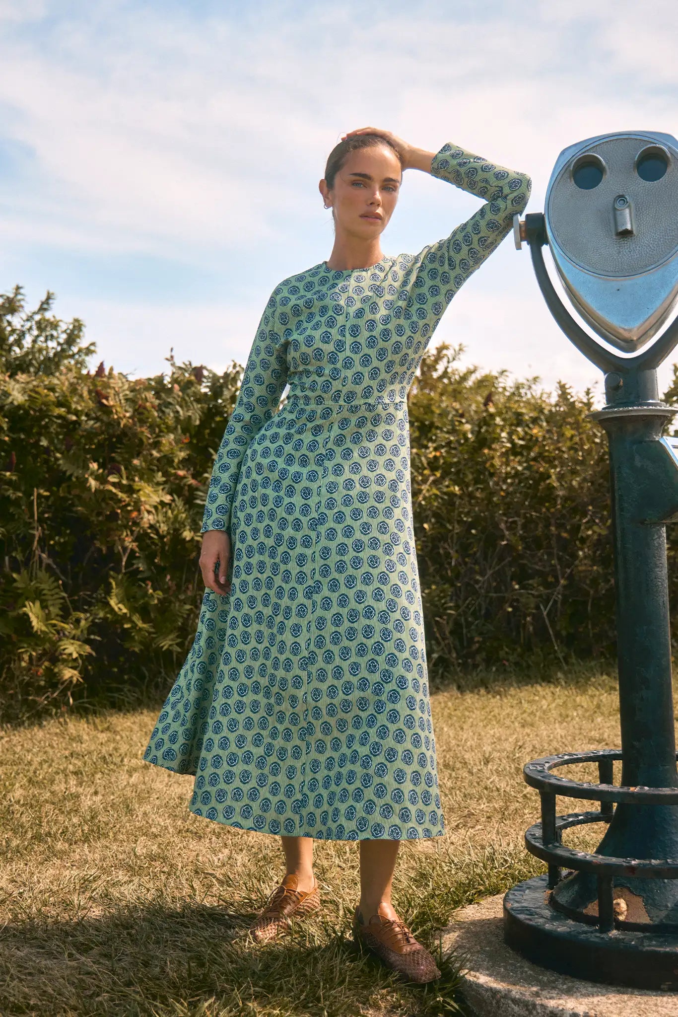 Midi dress with a clean crew neckline, modern dolman sleeves, with a circle-cut skirt.