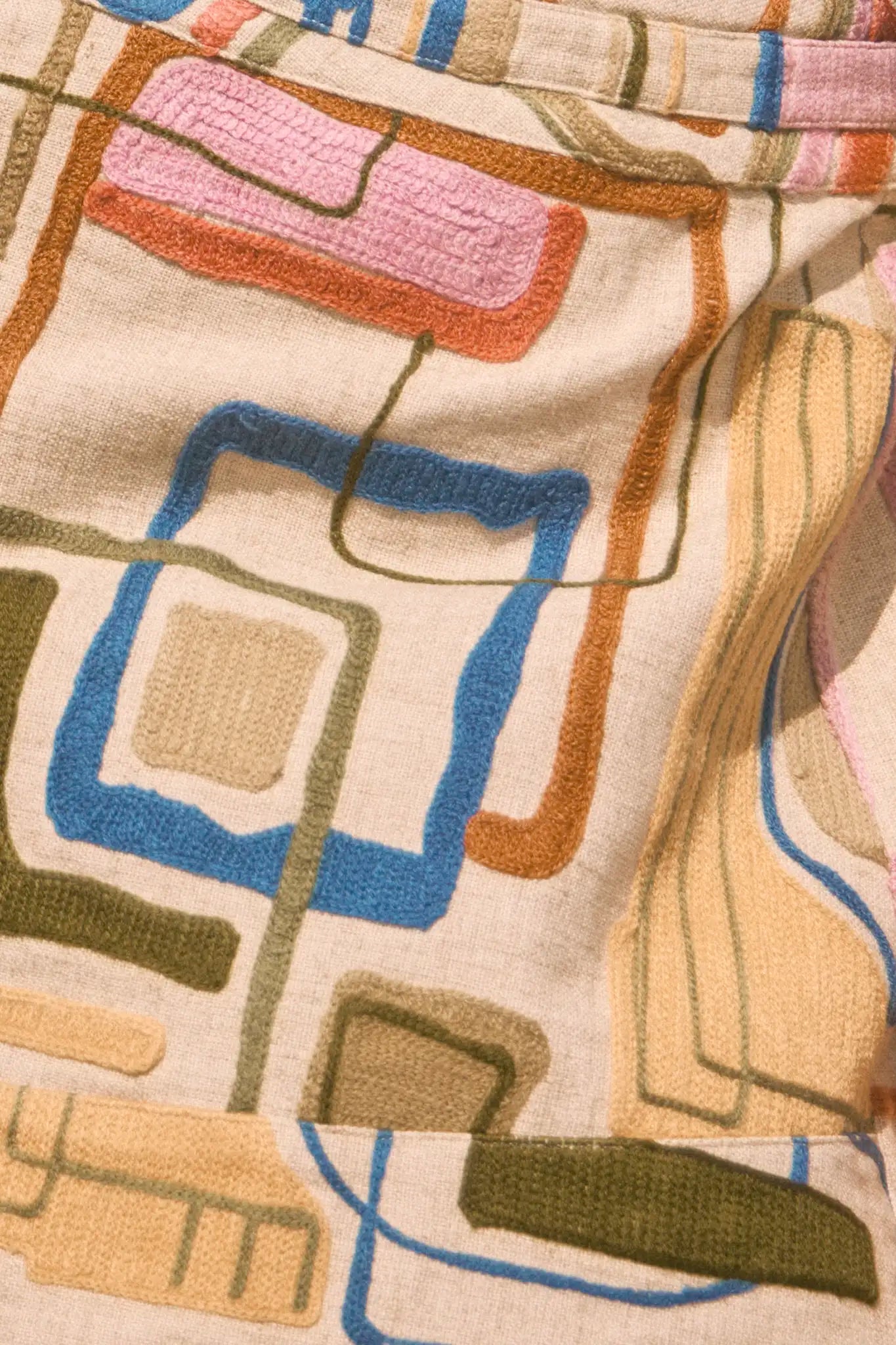 Throw-on jacket with curved, open front, and dolman sleeves.