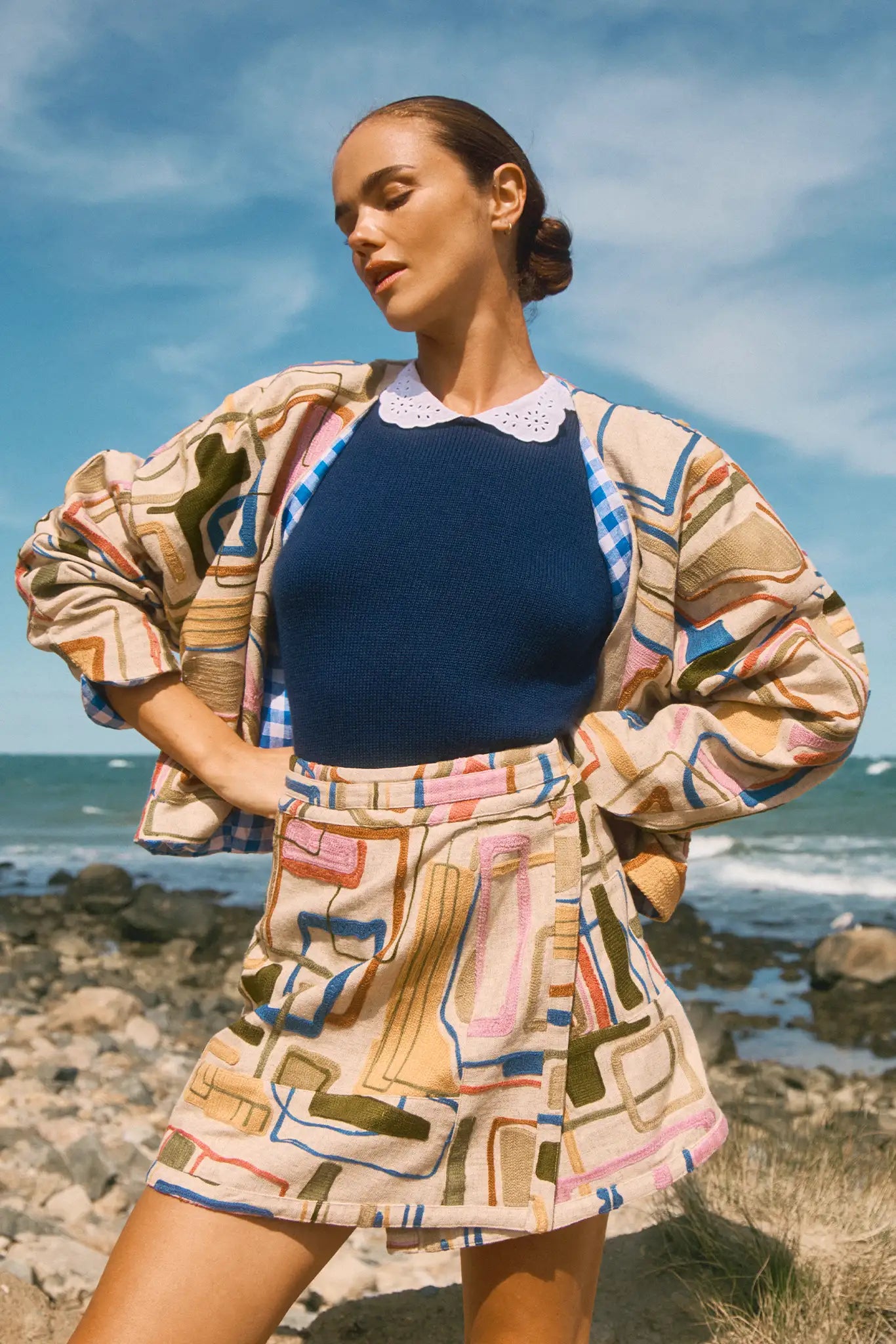 Skirt with a banded waist and sleek wrap silhouette with discreet snap closure.