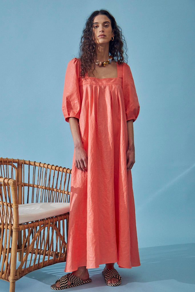 The Waverly maxi dress has a square neckline, elbow length balloon sleeves and pleats at the bodice.