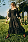 The Zadie Dress has a square neckline, flowy elbow-length sleeves, a fitted bodice and a full skirt.
