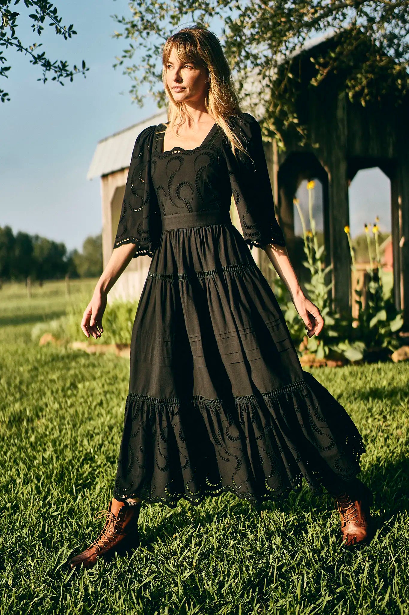 The Zadie Dress has a square neckline, flowy elbow-length sleeves, a fitted bodice and a full skirt.