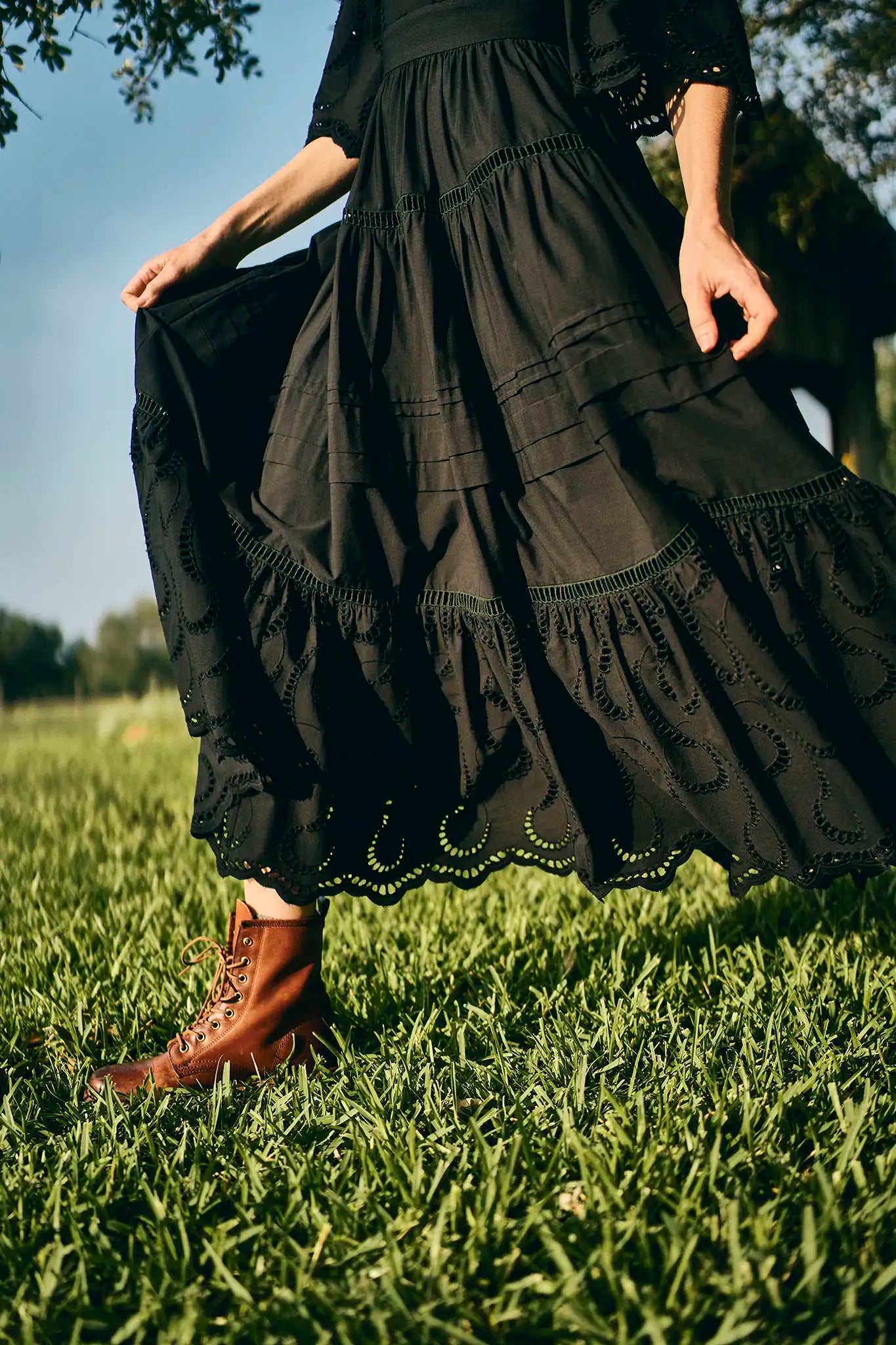 The Zadie Dress has a square neckline, flowy elbow-length sleeves, a fitted bodice and a full skirt.