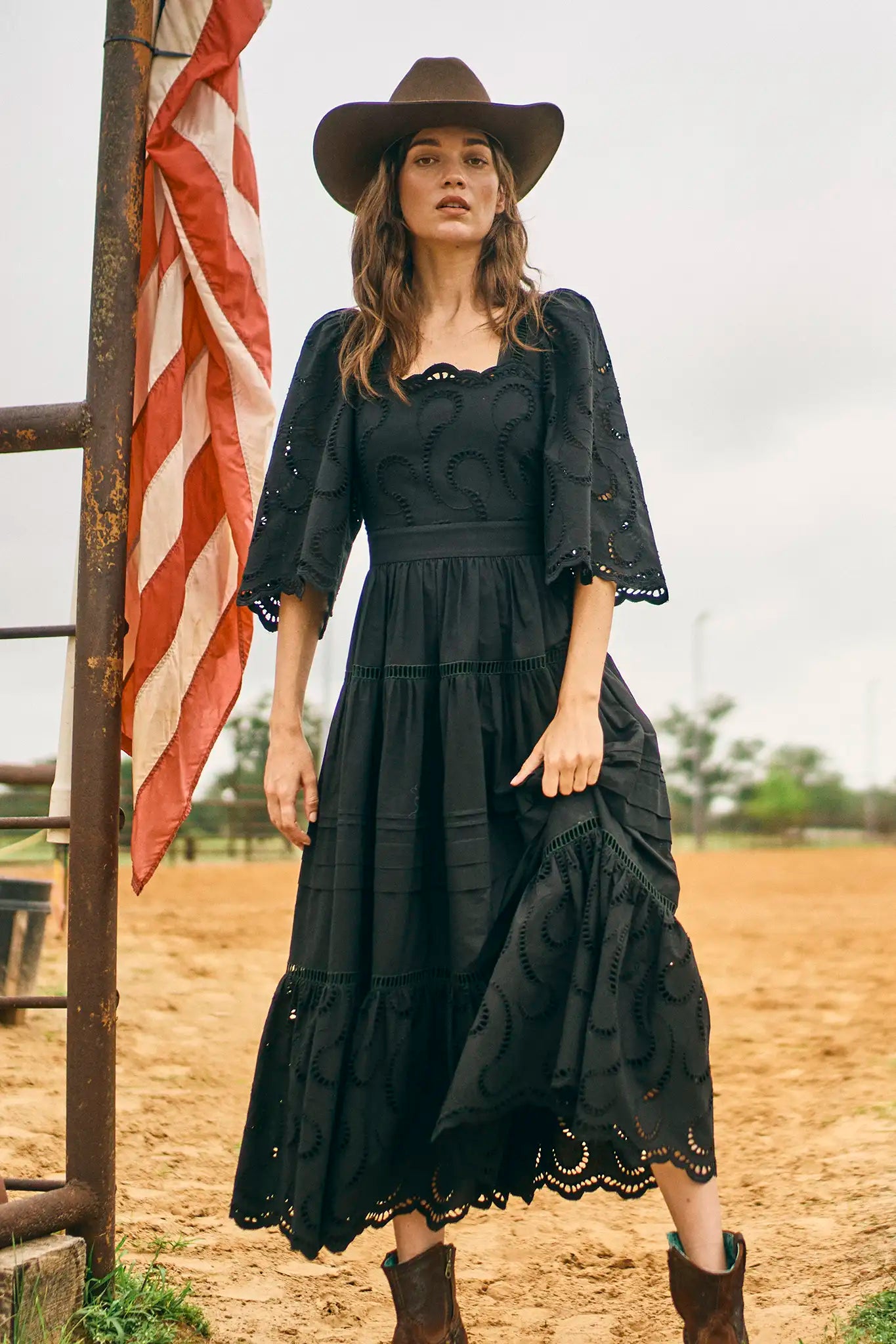 The Zadie Dress has a square neckline, flowy elbow-length sleeves, a fitted bodice and a full skirt.