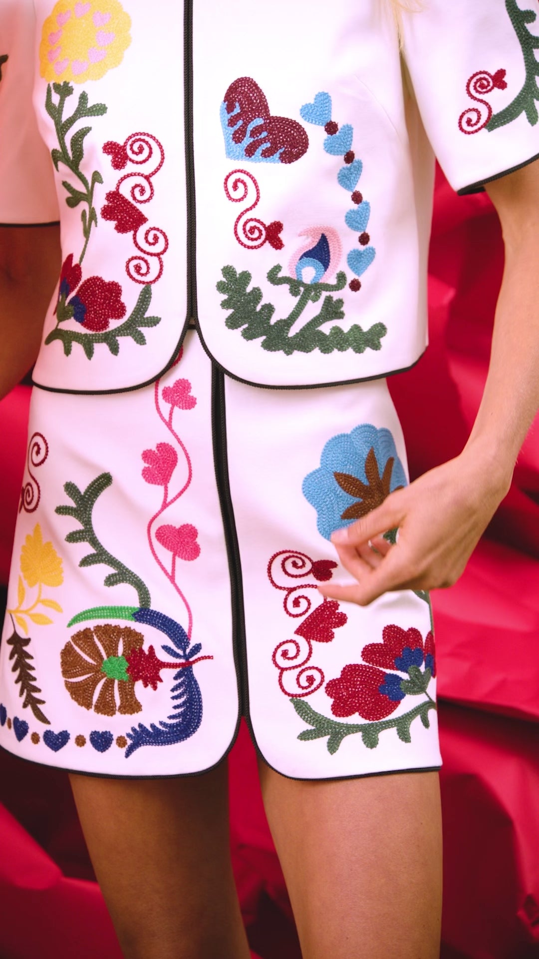 The Beeson Top is a crew neckline and elbow-length sleeves, non-fitted bodice with colorful detail
