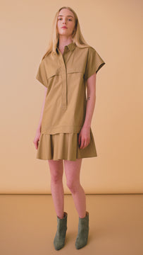 This drop waist mini dress has a collared neckline and a hidden front button placket.