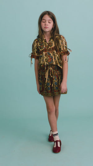The Kids Mayfair Blouse in Amber Glen Cream paired with the Rosie Skirt in Amber Glen Brown.