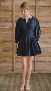 Navy diamond-smocked novelty shirting fabric with a soft V effect and blouson sleeves.