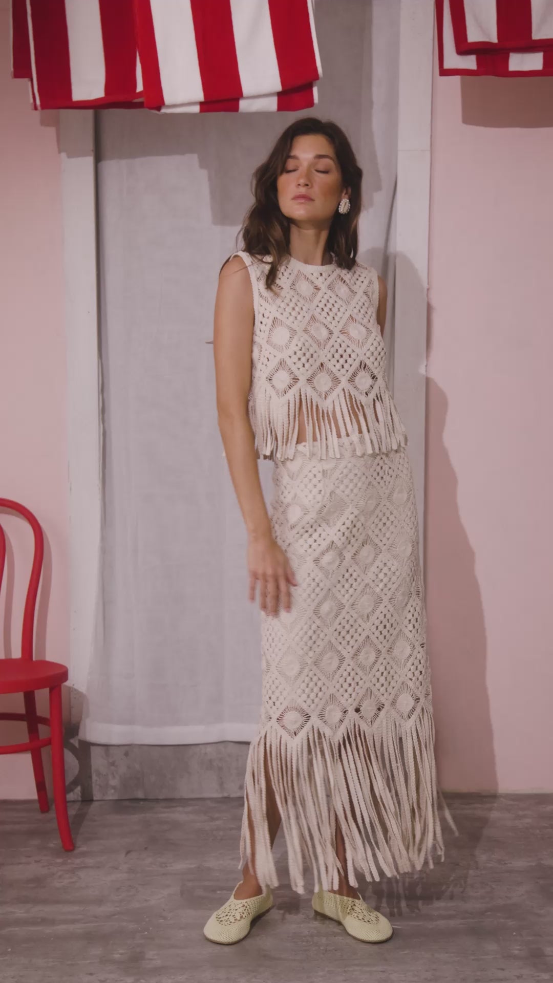 The Astor Top in cream paired with matching skirt.