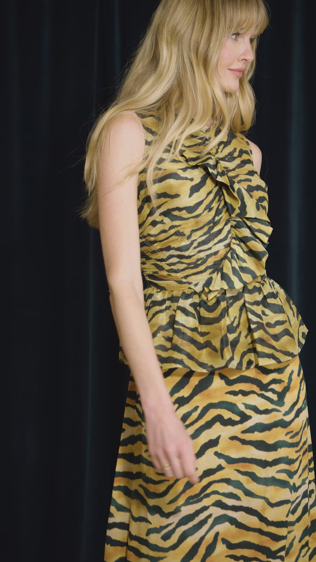 The Suki Skirt is in tiger print this season, with fitted pencil silhouette and easy pull-on design