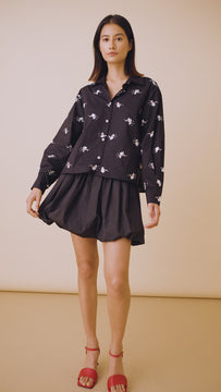 The Hudson Shirt has embellished sequin clusters, metal novelty buttons and a collared neckline.