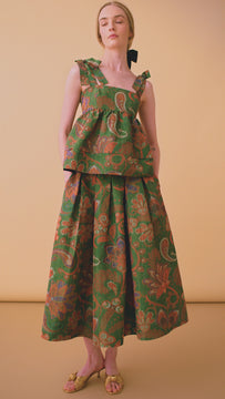 The Alexis Skirt is made of an Italian yarn dyed Ikat taffeta with pleats and side seam pockets.