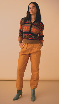 The Lewis fair isle pullover has contrasting ribbed details at the collar, sleeve cuffs, and hem.