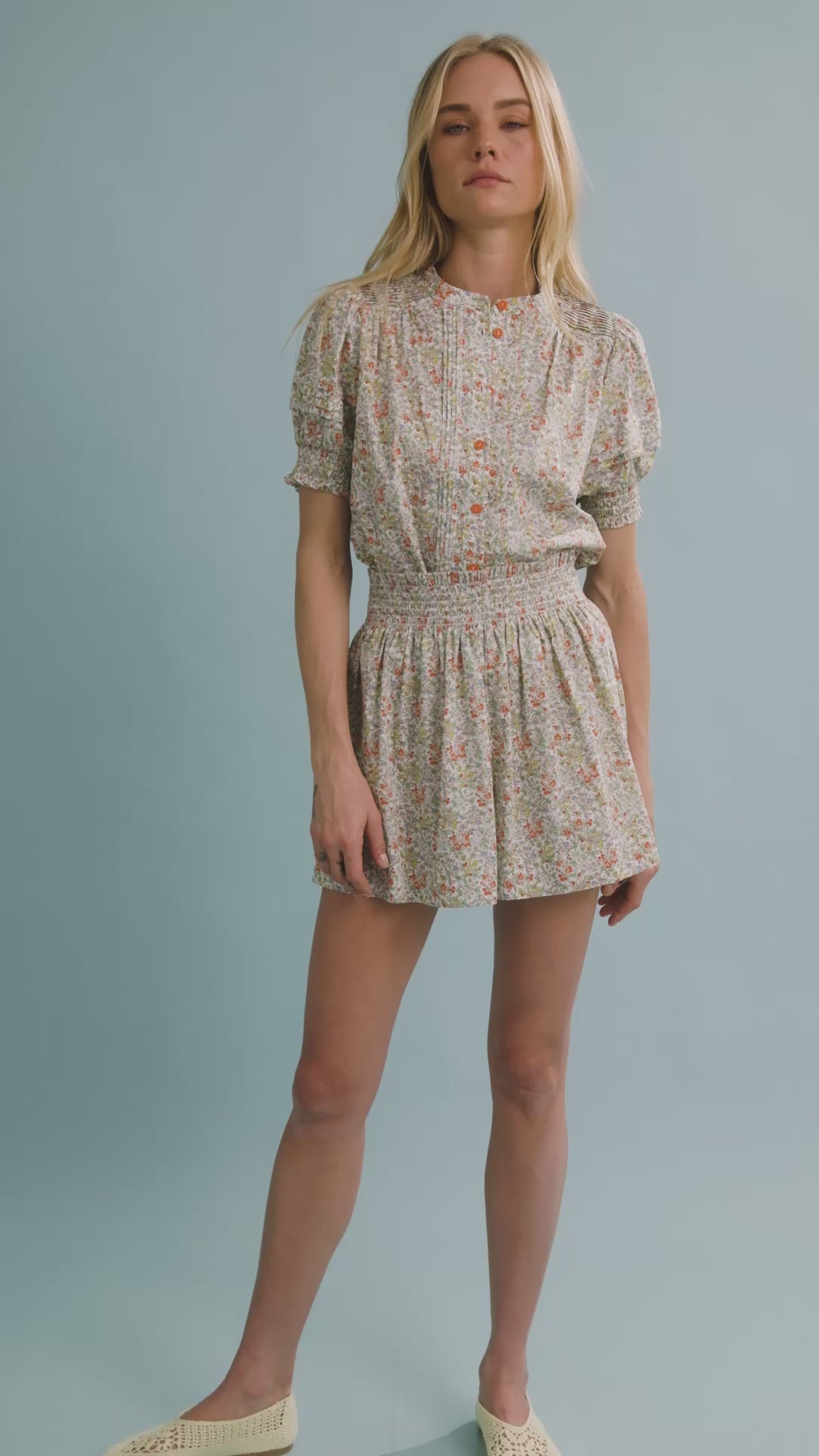 The Hartley Top in Coral Multi, puff sleeve top with coral buttons paired with matching Jemma Short.