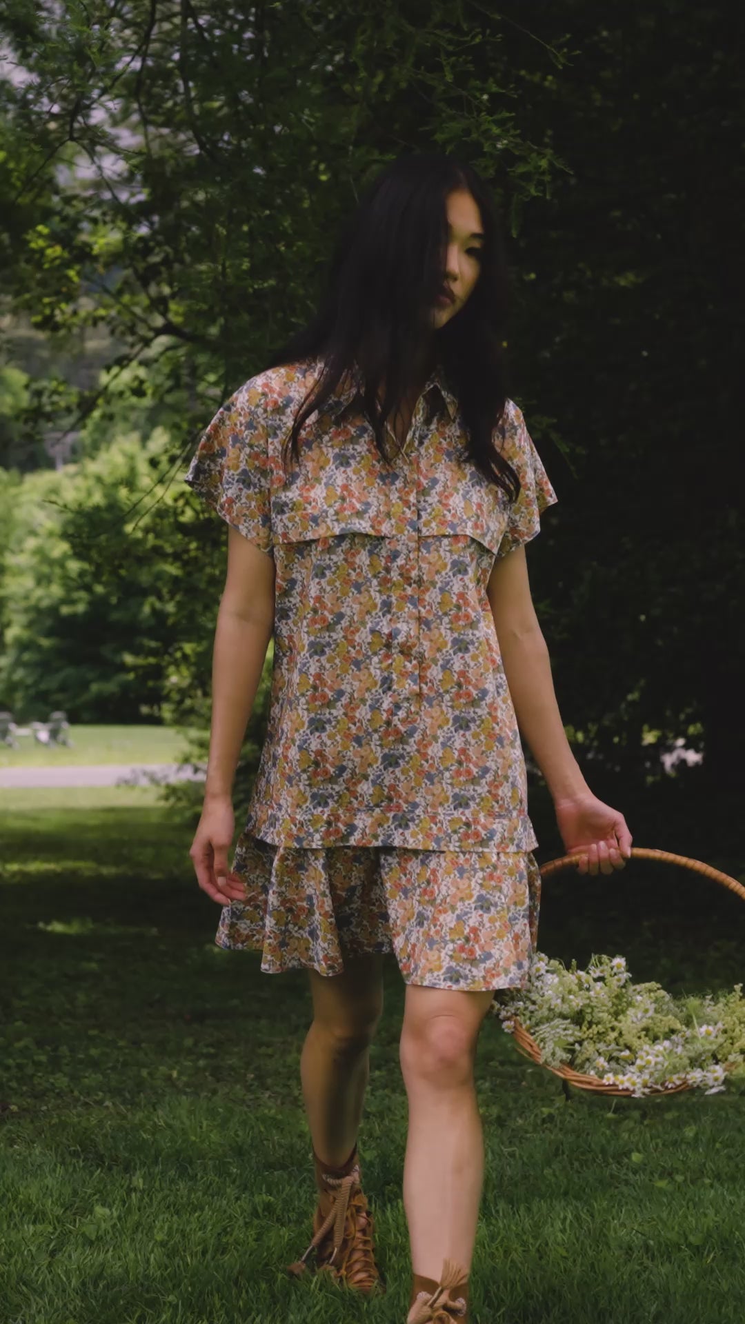 The Addison Dress, Made with Liberty Fabric floral dress, carrying a basket of florals.