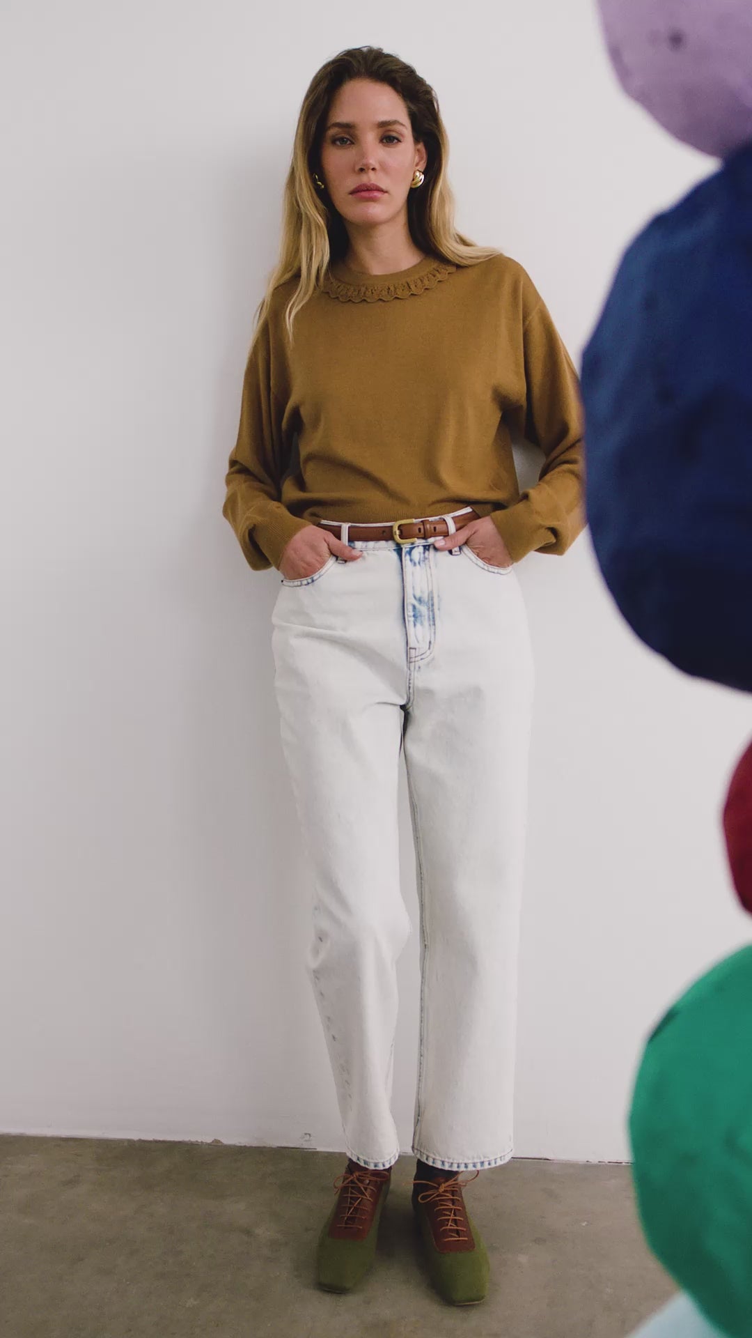 The Opal Sweater in Chestnut paired with the Wray Pant in washed blue denim. 