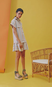 The Addison dress is a drop-waist mini with a collared neckline and hidden, front button placket.
