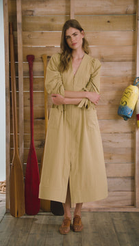 V-neck midi dress with a fitted bodice, full skirt, elbow-length sleeves finish with ties.