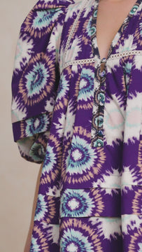 The Jenkins dress is back in a purple London rain print with a contrast color inserted ladder trim.