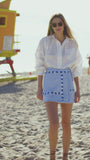 The Bay wrap skirt has a special textured weave and all-over fringe trim detailing.