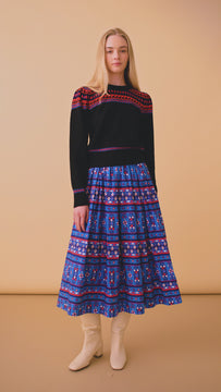 The Tatum block print midi skirt has a covered elastic waistband, a relaxed fit.