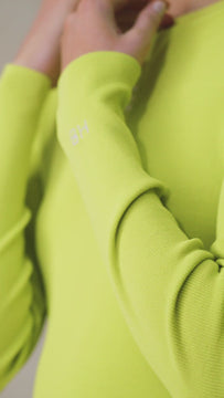 The Penn lime green crewneck sweater is a lightweight knit with an embroidered intarsia logo.