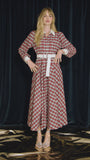 The Randolph Dress has a circle skirt, full length sleeves with button cuffs and optional belt.