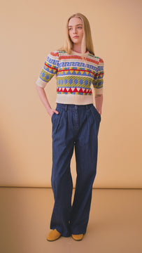 The Odette fair isle sweater has short puff sleeves, ribbed trim at the neck, hem, and cuffs.