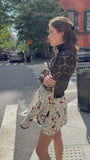 The Blaise Top in Noir Lace paired with the Atwood Jacket and India Skirt in Camellia Ivory. 
