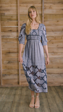 Embroidered Midi Dress with a square neckline, crochet lace tracing the bodice, skirt, and sleeves.
