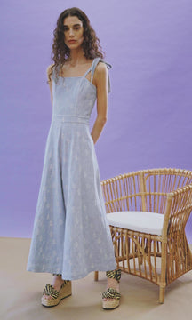The Alex Jumpsuit is has a square neckline, a wide leg silhouette and adjustable self ties.