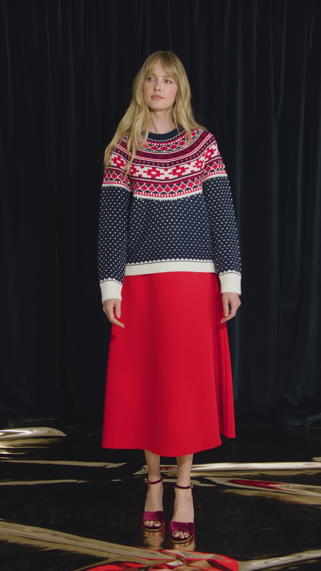 The Josie Sweater in St. Moritz Fair Isle has a ribbed crew neckline and long raglan sleeves.