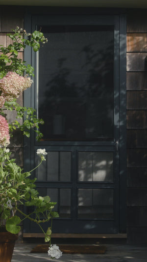 Screen door with flowers.