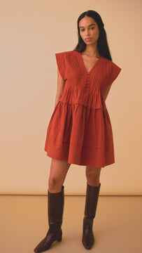 The Parker Dress has a v-neck, banded cap sleeves, pleated yoke, a drop waist and side seam pockets.