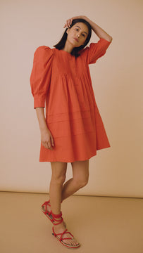 The Sidney dress has a crew neckline, ¾ length sleeves, pintuck detailing, side seam pockets.