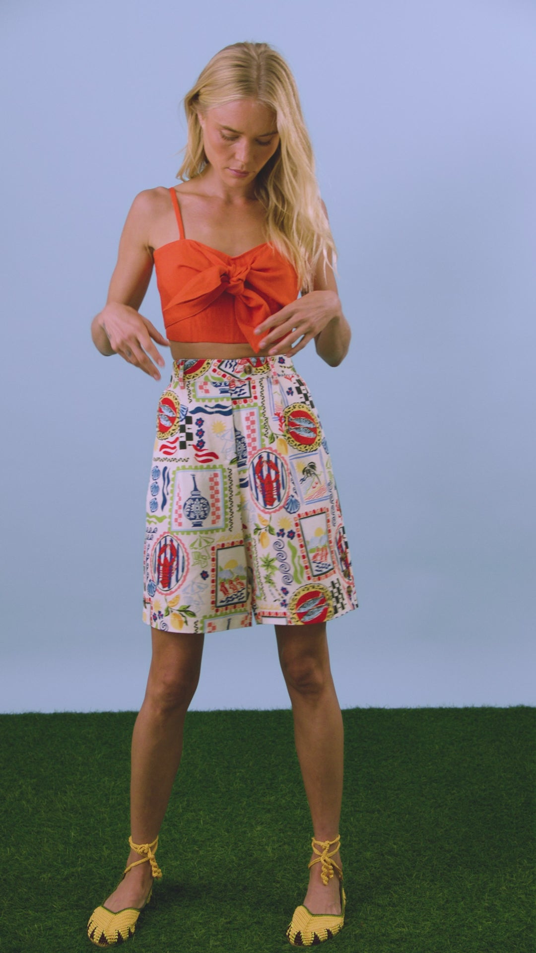 the Ginny Bermuda Shorts in Coastal Conversation paired with Pearl Top in Tangerine Tango
