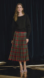 The Dominic Skirt has a banded waist and a straight pleated silhouette finished with front slits. 